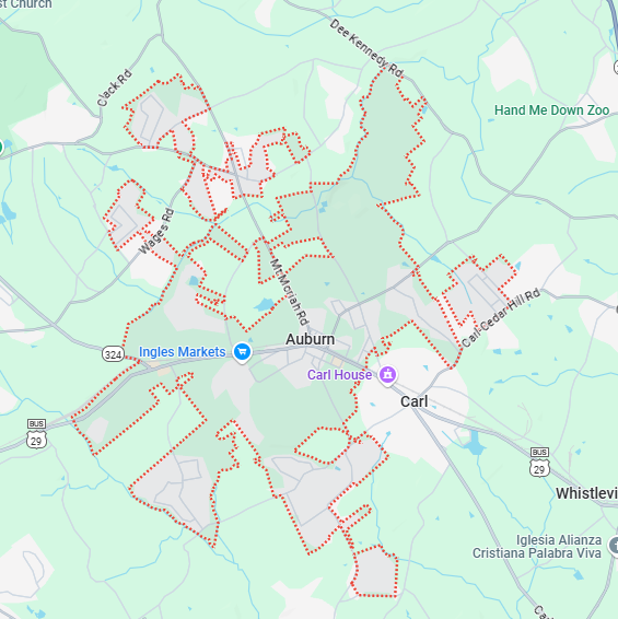 A localized street map with a red boundary line highlighting the area of Auburn, Georgia.