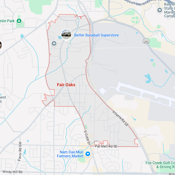 A localized street map with a red boundary line highlighting the area of Fair-Oaks, Georgia.