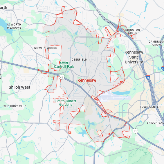 A localized street map with a red boundary line highlighting the area of Kennesaw, Georgia.