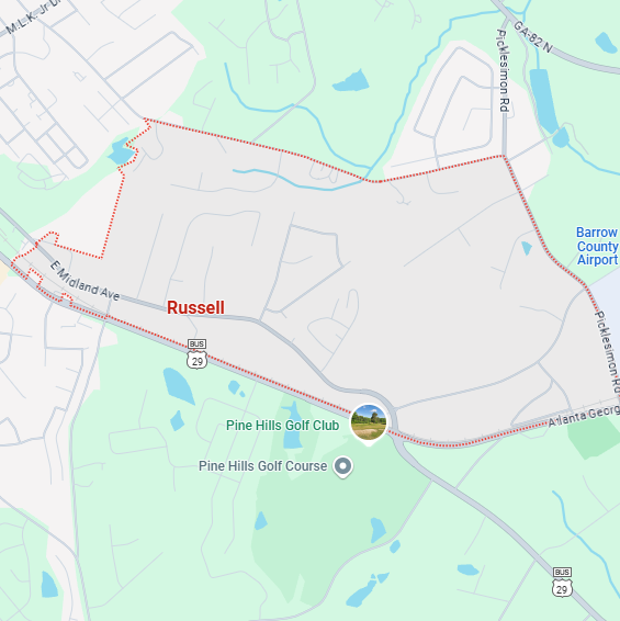 A localized street map with a red boundary line highlighting the area of Russell, Georgia.