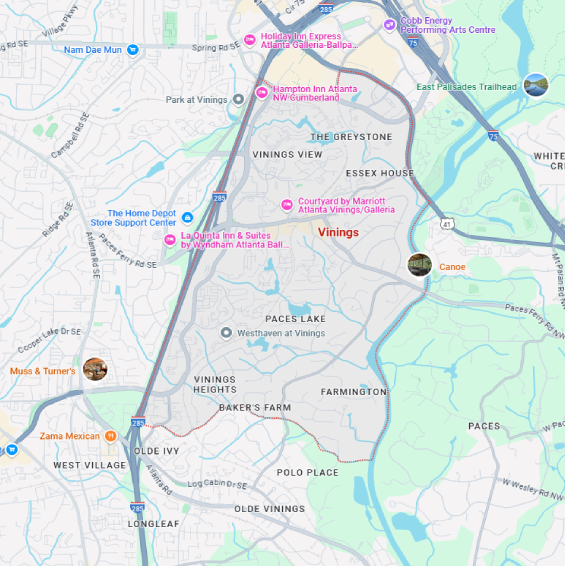 A localized street map with a red boundary line highlighting the area of Vinnings, Georgia.