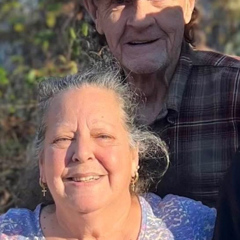 Happy older couple after selling their outdated Norcross GA home to POH Group LLC. Norcross home buyers at POH Group Homes purchased their house as-is for cash with no repairs, no realtor fees, and a fast closing.